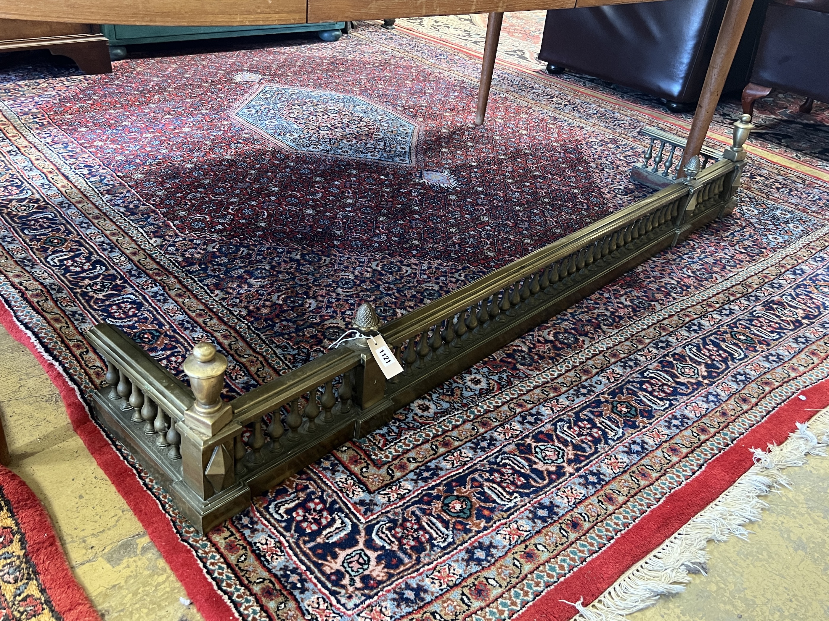 A large late Victorian cast brass fender, width 183cm, depth 32cm, height 30cm